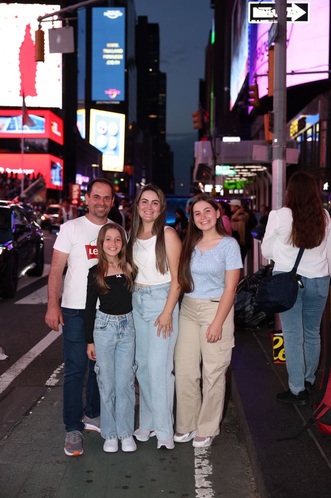 Family portrait in Times Square at night